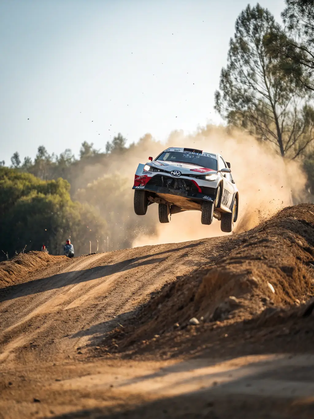 A dynamic image of a SART-sponsored rally car speeding through a challenging off-road course during a regional competition.
